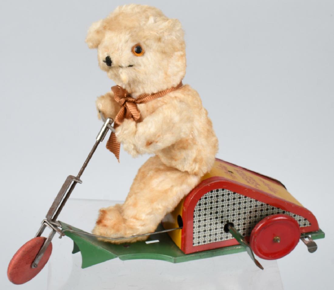 JS WINDUP BEAR ON MOTOR SCOOTER: Scarce toy. All original and complete. Windup works. 12" Excellent