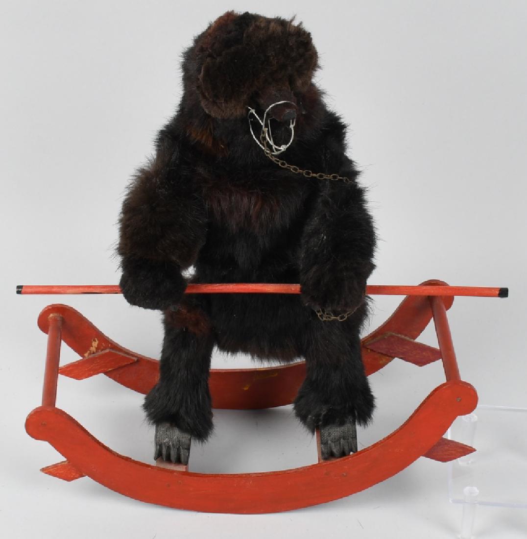 EARLY WINDUP CIRCUS BEAR ON ROCKING BASE: All original with glass eyes. Has muzzle. Clockwork not working. 14" Excellent