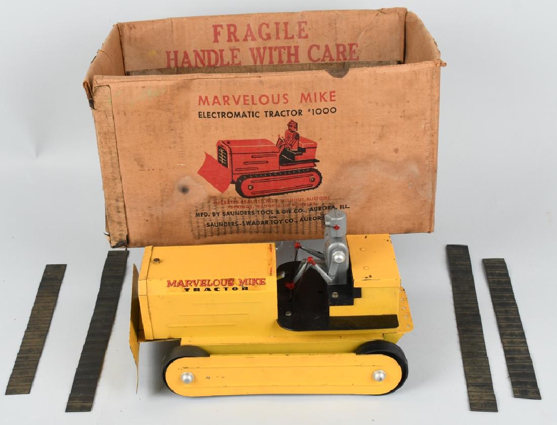 SAUNDERS MARVELOUS MIKE ROBOT TRACTOR w/ BOX: Original 1950's Marvelous Mike robot tractor with the original box. Tractor is metal with a plastic robot driver. Not tested, and rubber treads are in pieces. Original graphic box is fair. 14" Very Go