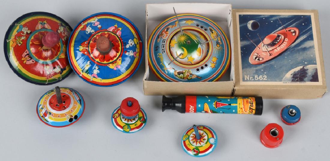 GERMAN tin friction SPACESHIP w/ BOX and MORE: German tin Spaceship has great graphics, works and measures 4" diameter. Also included are a Japan Space Telescope and tin Space Top. There are also 4 additional Japan tin tops in this lot. The larges