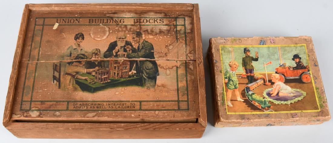 2 EARLY GERMAN TOY BLOCK SETS: One set has paper on wood blocks. The box is missing one edge piece and measures 8 1/2" by 7". The other set is called Union Building Blocks, and consists of two levels of stone blocks and paperwork. 