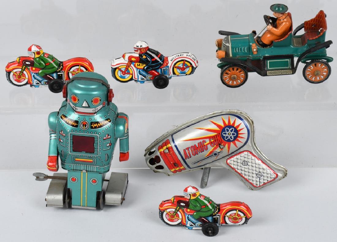 LOT OF JAPAN TOYS ROBOT MOTORCYCLES and MORE: Vintage japanese tin toy lot includes 5 1/2" tin Robot, a 5" tin friction Roadsdter, 3 tin 3 1/2" friction Motorcycles, and a Atomic Space Gun. All are in working condition. Excellent