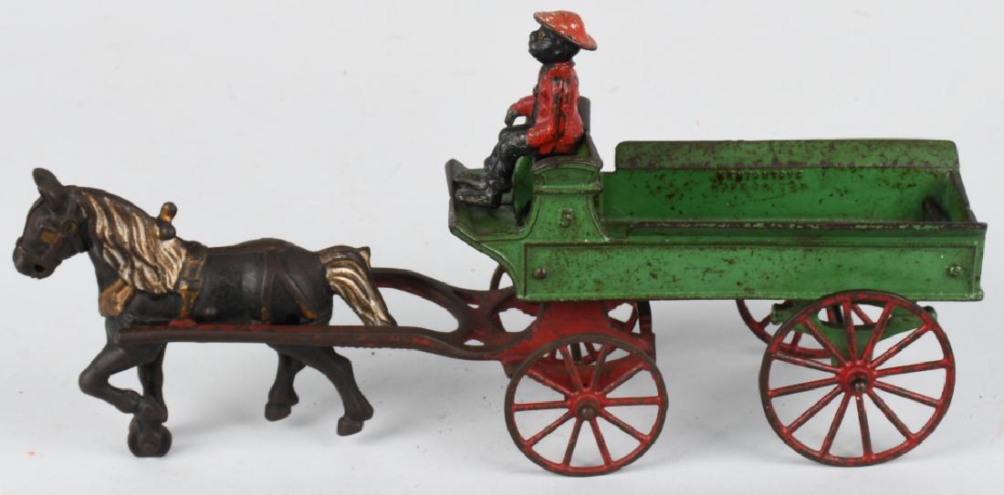 KENTON cast iron HORSE DRAWN WAGON: All original Kenton cast iron horse drawn wagon with driver. No cracks or breaks. May clean to a higher grade. The driver is an old original driver, but not for this toy. 15", Very Good