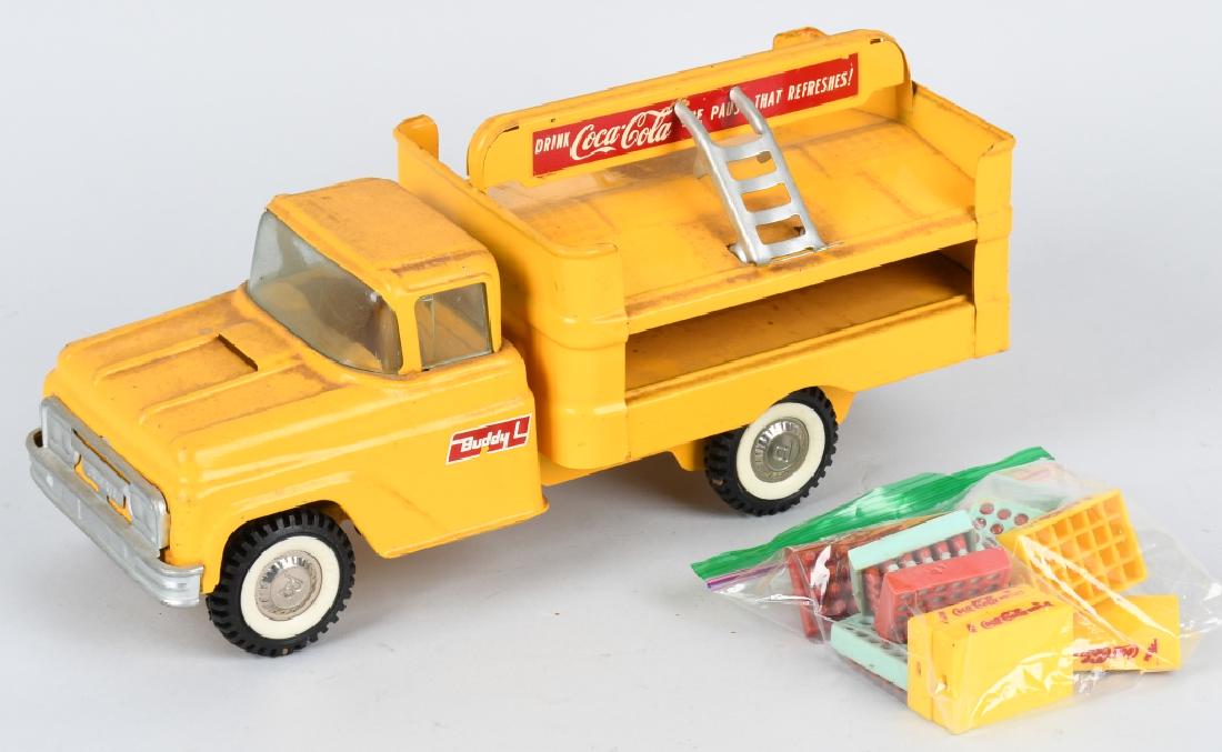 BUDDY L 1950's COCA COLA TRUCK: Nice all original Buddy L Coca Cola truck with case and 2 dollys. Nice paint and decals. Should clean to a higher grade. 15" Very Good-Excellent