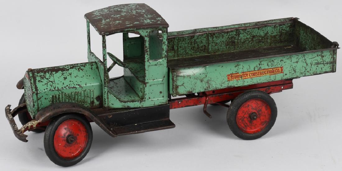STURDITOY 1920's CONSTRUCTION DUMP TRUCK: Nice looking truck with deluxe paint combination. Complete except for headlights. All original paint, decals and tires. Dump bed works fine. Overall play wear. 27", Good-Very Good