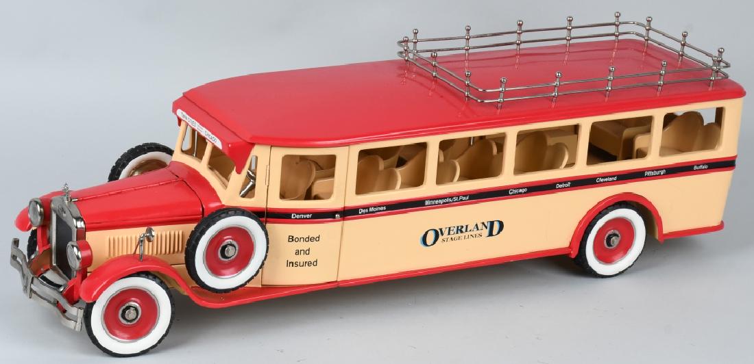1920's STYLE OVERLAND STAGE LINES BUS RETRO 1-2-3: Limited edition pressed steel "Overland Stage Lines" made by Retro 1-2-3 LLC, of Chicago. Made in the style of toys from the 1920's. Very colorful and detailed bus features dual side mounts, opening h