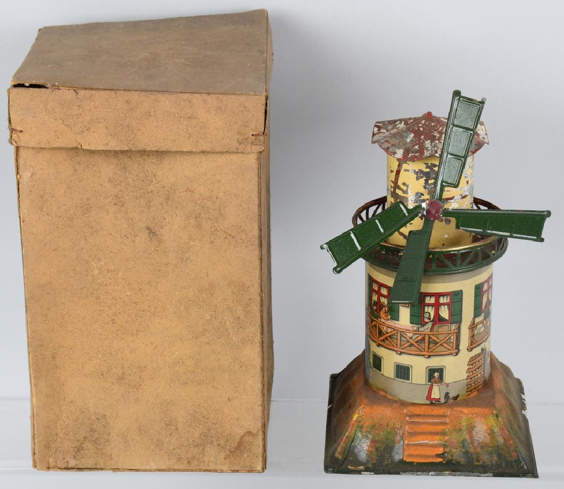 EARLY GERMAN tin WINDMILL STEAM ACCESSORY w/ BOX: Early German tin litho and hand painted steam accessory windmill with the original box. Has paint flaking. 8 1/2" high, Base is 5 1/4" by 5 1/4". Very Good