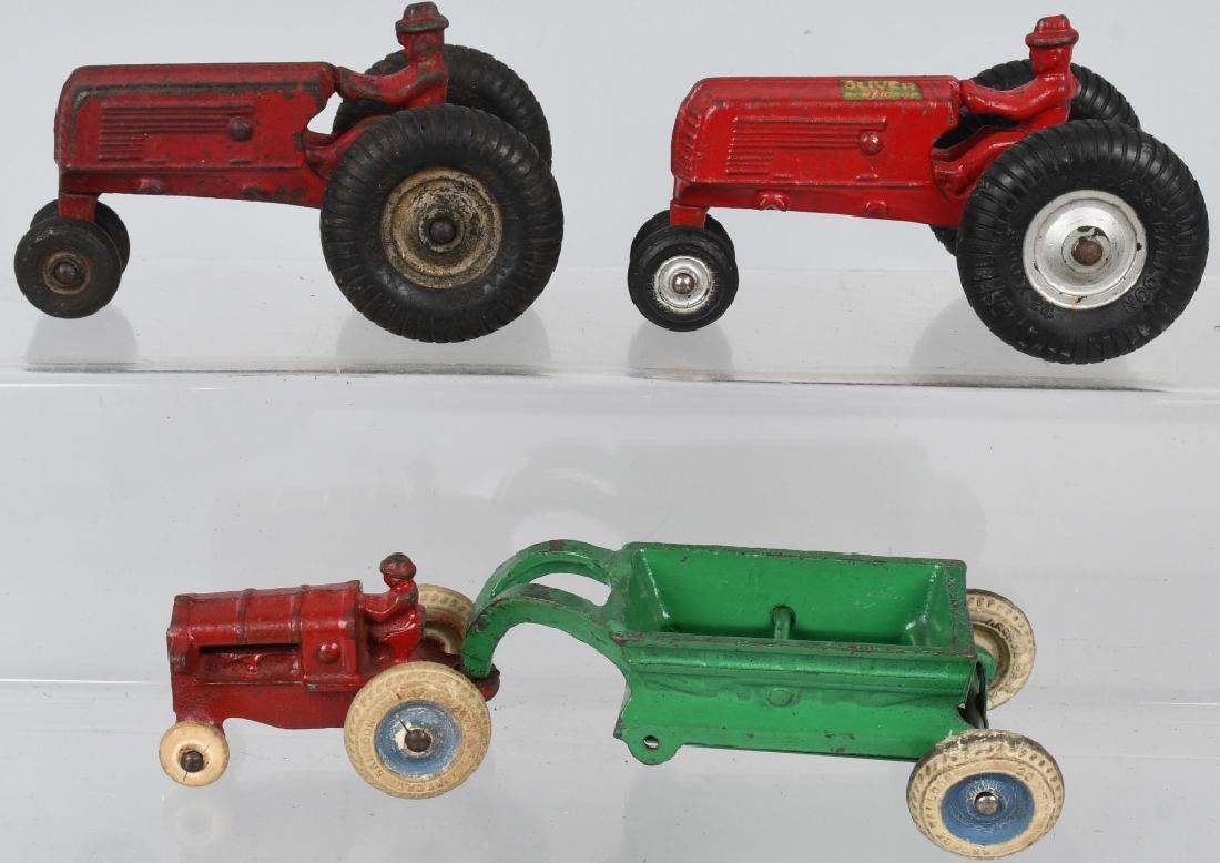 3 ARCADE cast iron TRACTORS OLIVER and MORE: Lot includes 2 Arcade 5 1/2" Oliver Row Crop tractors. Both are all original and one is excellent with decals. Also included *: McCormick Deering Tractor and dump trailer. No cracks or breaks. Very Go