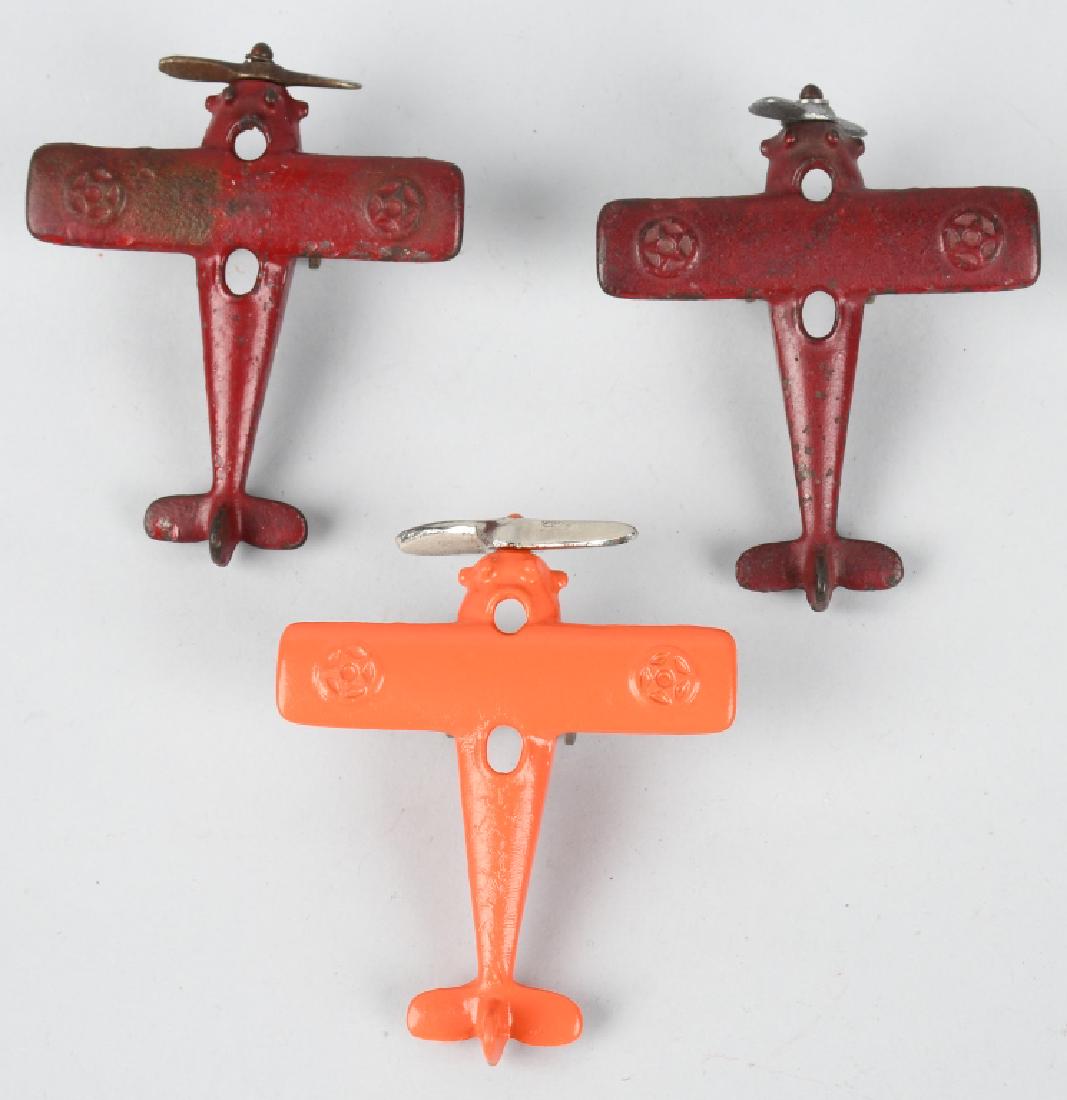 3 KILGORE cast iron AIRPLANES: Two airplanes have original paint and the orange one is restored. One is all original, and two have replaced props. Very Good