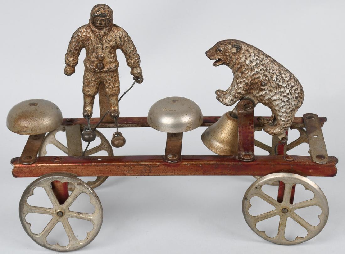 WATROUS cast iron PEARY & POLAR BEAR BELL TOY: Produced by Watrous around 1909 when explorer Robert Peary reached the North Pole. Made of cast iron and pressed steel. Complete and original. 10" Excellent