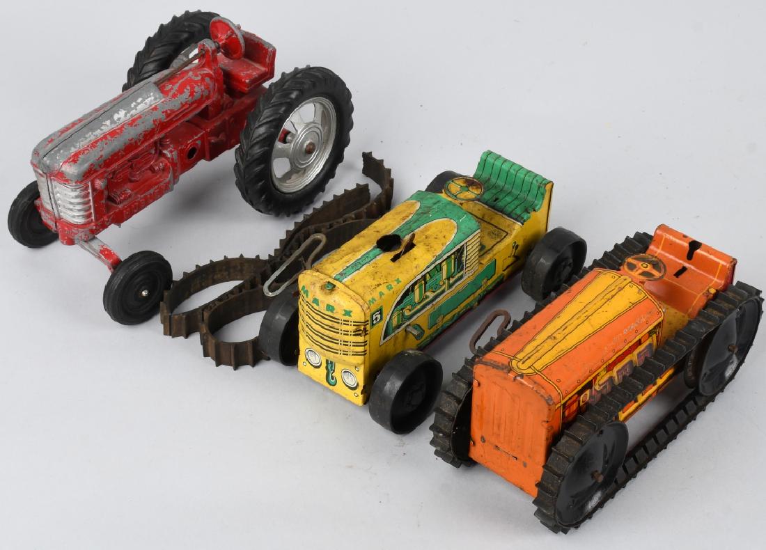 3 MARX and HUBLEY TRACTORS: Lot includes 2 Marx tin windup tractors that worked when tested, along with a 9" diecast Hubley tractor. One tractor has broken treads. Good
