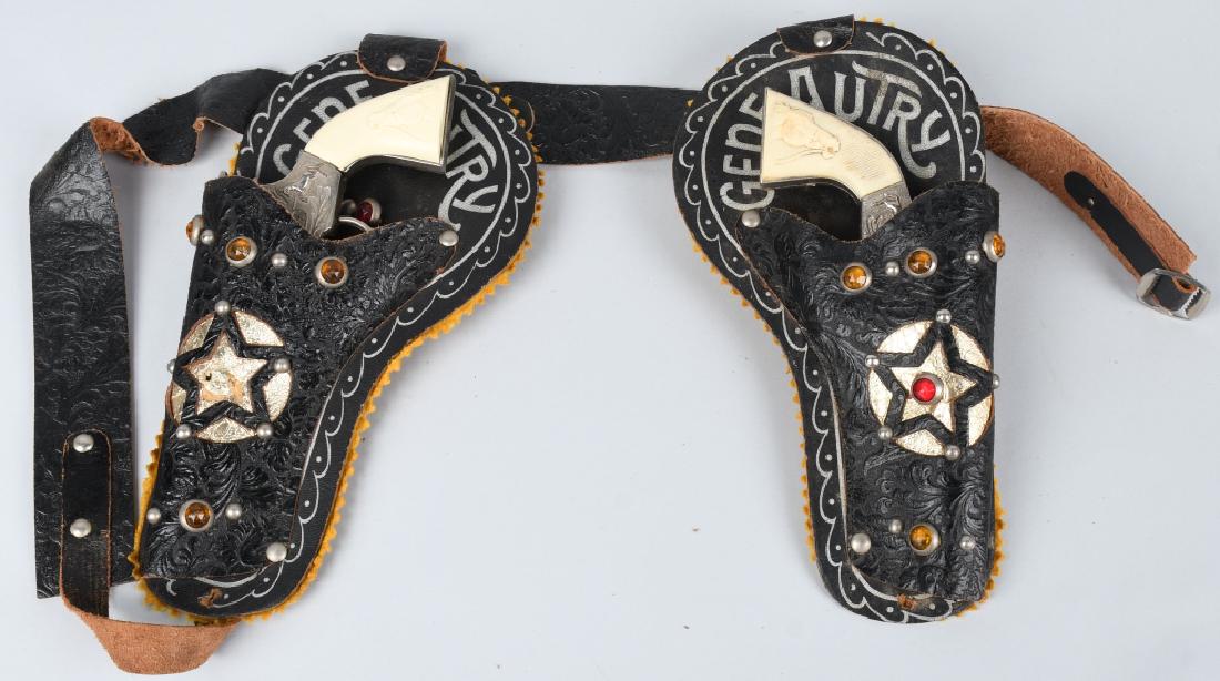 GENE AUTRY CAP GUN SET CAP GUN & HOLSTER: Pair of Gene Autry Cap Guns all original and work. With Gene Autry leather Holster. 8 1/2" Excellent