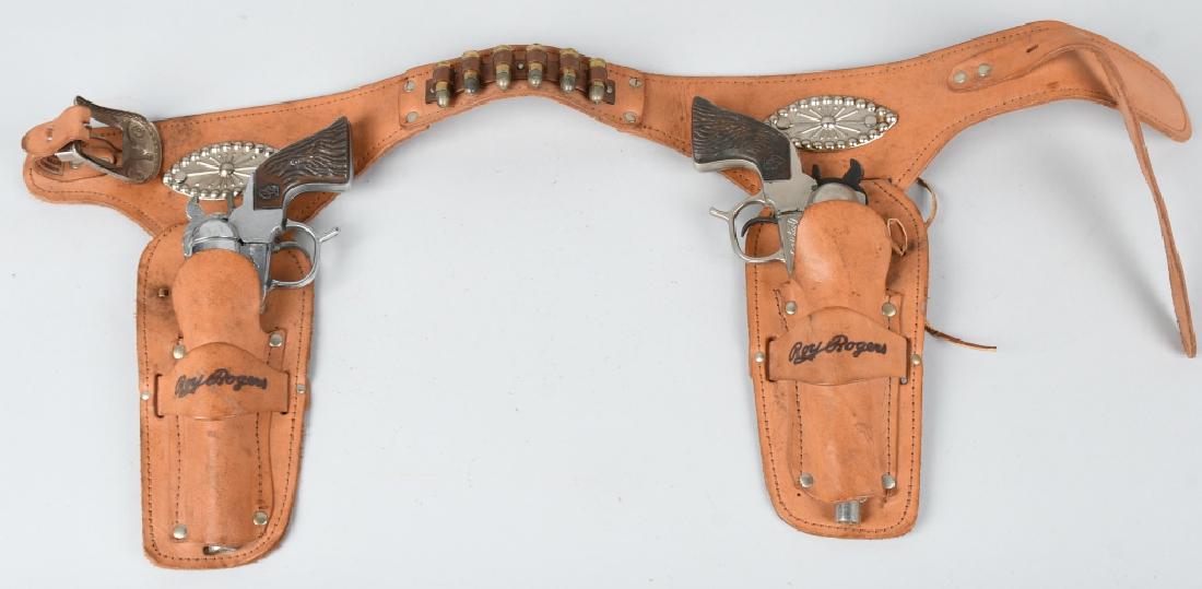 ROY ROGERS CAP GUN SET w/ LEATHER HOLSTER: Roy Rogers Cap Gun Set. Both original and working. With correct leather Holster. 10" Excellent
