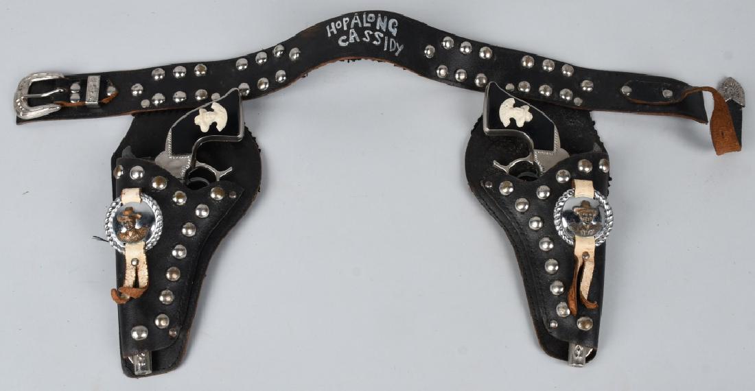 HOPALONG CASSIDY CAP GUN SET & LEATHER HOLSTER: Set of Hopalong Cassidy Cap Guns both original and work. With correct leather Holster. 10" Excellent