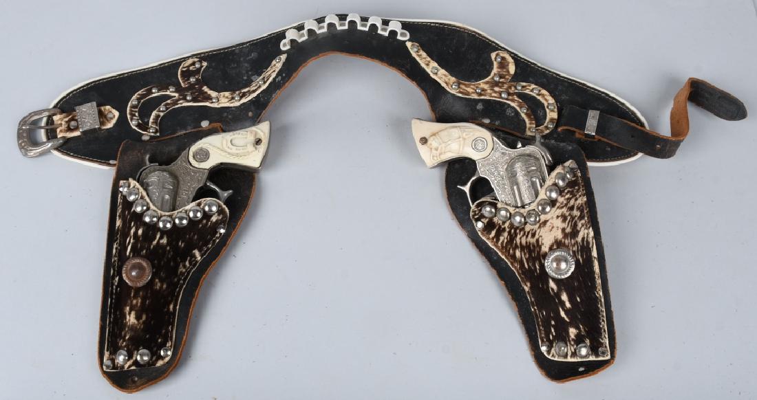 RED RANGER CAP GUN SET w/ LEATHER HOLSTER: Pair of Red Ranger Cap Guns both original and work. With leather and cow hide Holster. 9 1/2" Very Good-Excellent