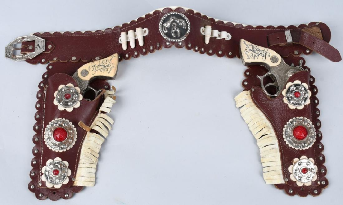 HOPALONG CASSIDY CAP GUN SET w/ LEATHER HOLSTER: Set of Hopalong Cassidy Cap Guns both original and work. With leather Holster. 9 1/2" Very Good-Excellent