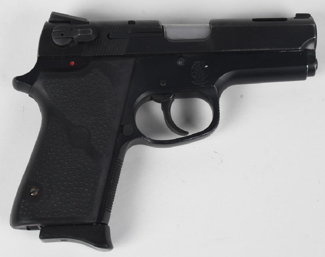 SMITH & WESSON 3914 9MM SEMI PISTOL 4 MAGAZINES: SN VAD7185. 3.5" barrel semi automatic pistol in 9mm. Smith & Wesson Model 3914. Features ported barrel, adjustable sights, fitted with rubber Hogue grips, and comes with 4 magazines. Matte black fini