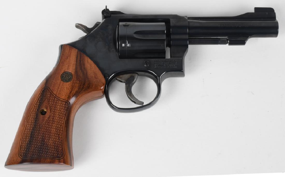 SMITH & WESSON MODEL 48-7 22 MAGNUM REVOLVER: SN CTX9894. 4" barrel 6-shot revolver in .22 Magnum Rimfire. Smith & Wesson Model 48-7 / K22 MRF. Features adjustable rear sight, blued finish, and large wood grips. Finish 100% action crisp, bore nea