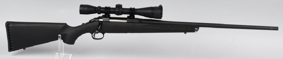 RUGER AMERICAN RIFLE 243 WIN BOLT ACTION RIFLE: SN 692-03299. 23" barrel bolt-action rifle in .243 Winchester. Ruger American Rifle, features synthetic stock, rubber recoil pad, blued finish, and fitted with Leuopold scope. Bore and action near min