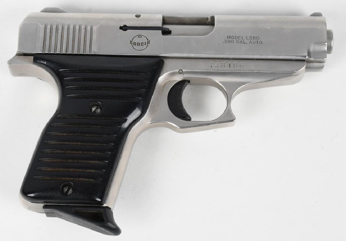LORCIN L380 SEMI AUTOMATIC PISTOL 380: SN 448186. 3.5" barrel semi automatic pistol in .380. Lorcin L380. Features stainless finish, 3-dot fixed sights, and black plastic grips. Includes 1 factory 7-shot magazine. Bore excellent, action fl
