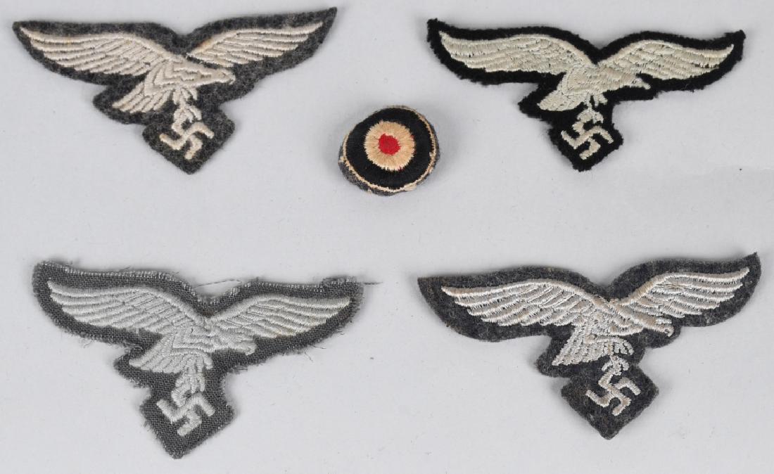 WWII LUFTWAFFE EM/NCO'S OVERSEAS M43 CAP EAGLES: Lot of 4 Machine embroidered second pattern (Circa 1936/1937-1945) Luftwaffe eagles clutching a canted swastika in one talon in silvery/gray rayon threads with 3 of them being mounted on a cut-out Luf