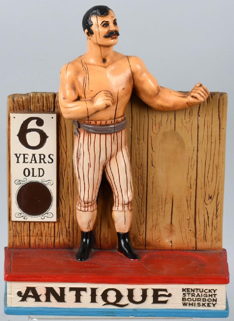 ANTIQUE WHISKEY CHALKWARE ADVERTISING FIGURE: Nice original Chalkware advertising figure for Antique Whiskey. Great image of old time boxer. Display is all original and very colorful. 15" Excellent