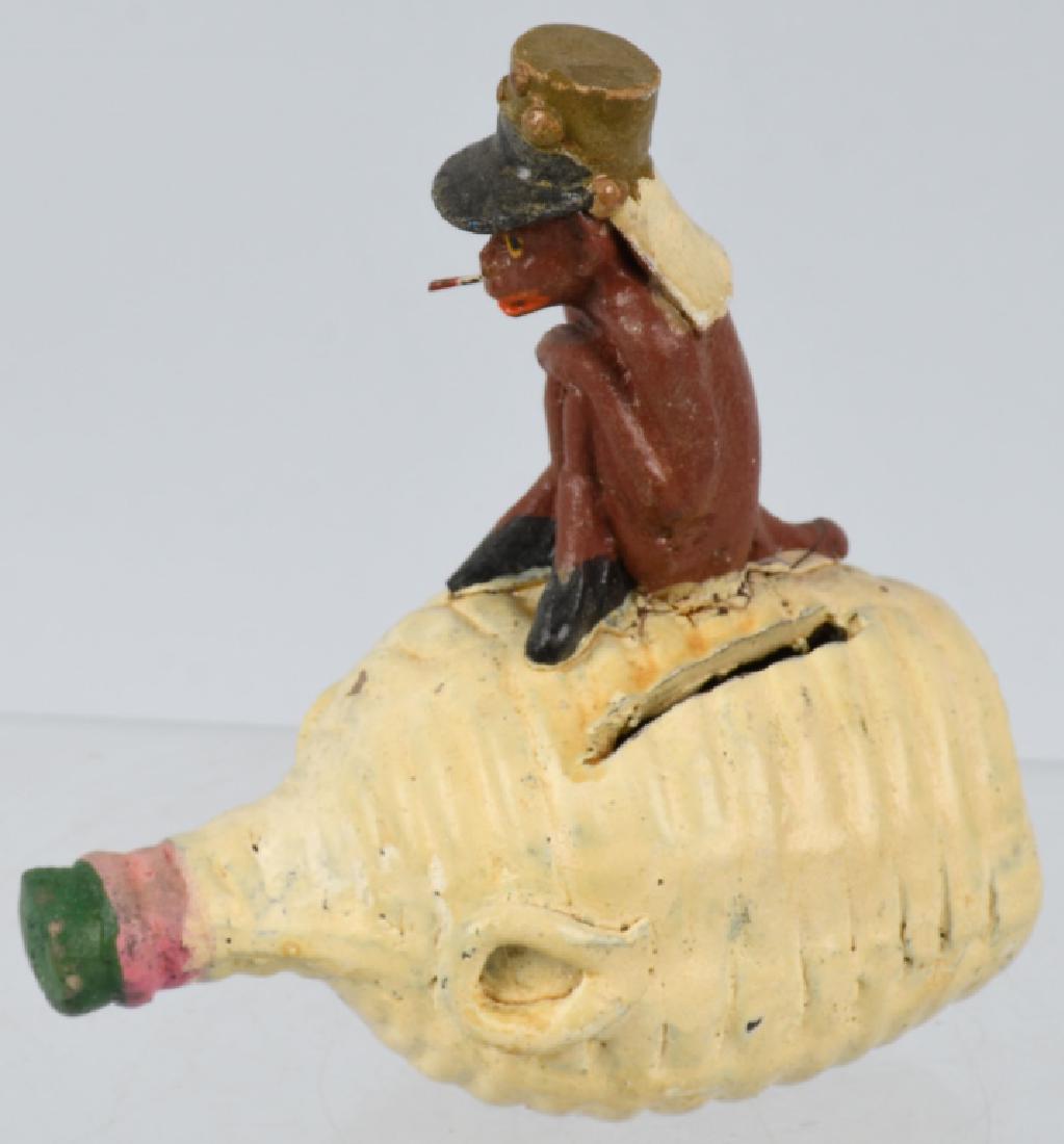 FRENCH FOREIGN LEGION MONKEY BANK: Original composition bank with Money in French Foreign Legion Hat sitting on Jug of Wine. Possibly a play on the story by Theodore Roscoe Money See Monkey Do.