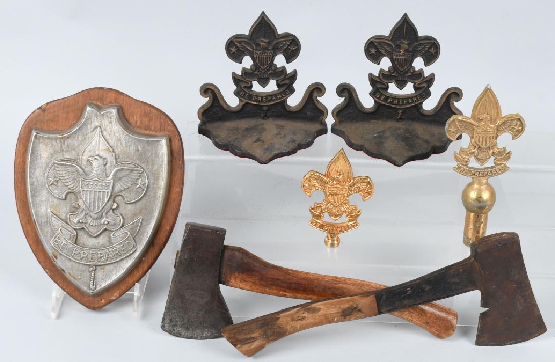 VINTAGE BOY SCOUT LOT: Lot includes 2 different Boy Scout hatchets, one is made by Plumb the other by Bridgeport. There is a 10" by 8" plaque with cast aluminum Boy Scout logo, a pair of licensed cast iron Boy Scout bookend