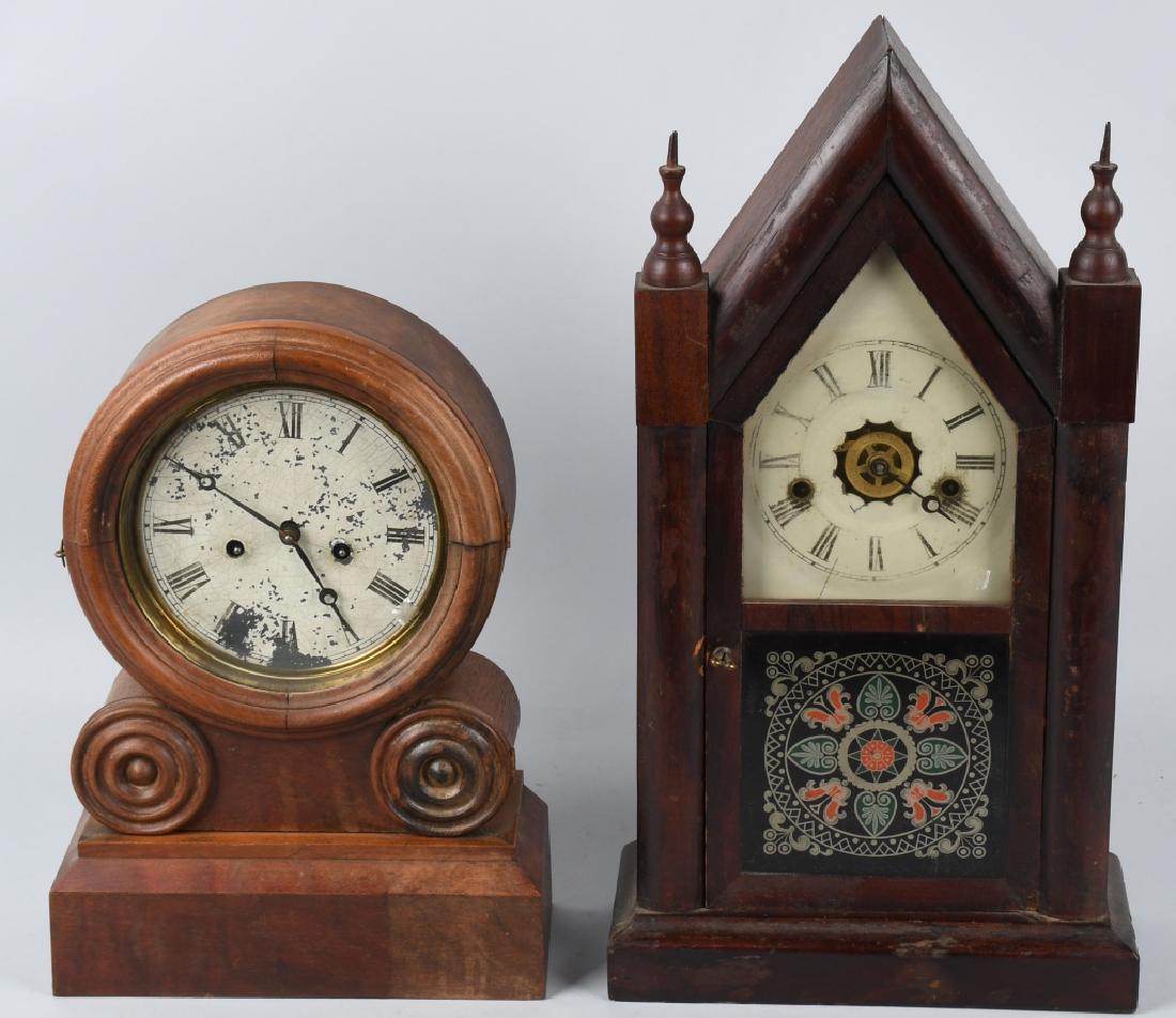 2-ANTIQUE SHELF CLOCKS, ANSONIA, & INGRAHAM: The Cathedral clock is made by Ingraham, and the other clock is Ansonia. Both have wood case. Largest is 20" by 11". Good-Very Good