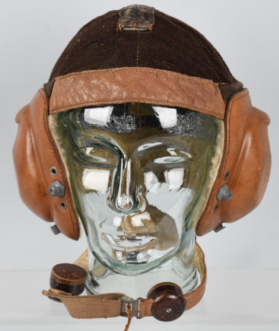 WWII NAZI GERMAN LUFTWAFFE NET TOP FLYING HELMET: Model L Kp N 101. Luftwaffe summer flying helmet, with net top, fur lining, receivers, and throat microphone. Marked "bxo" and has size "58" stamped in red ink. Complete, and original. Excellent