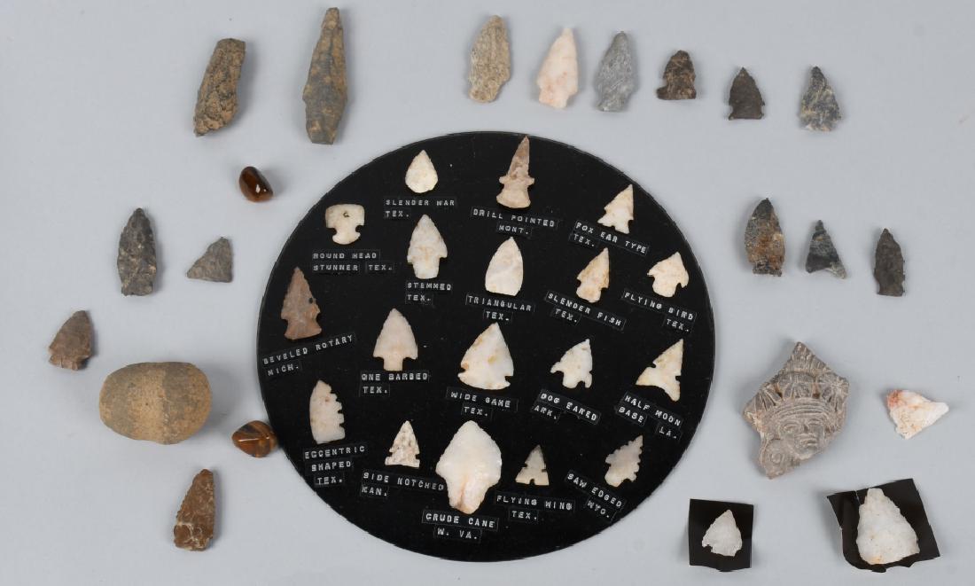 38 Pc. COLLECTION ARROWHEADS, POTSHARDS, MAUL: Approximately 38 pieces. Includes arrowheads mounted to a glass plate with identification, flint and a stone maul. Also includes 2 polished stones that look like petrified wood, and a potsherd with an