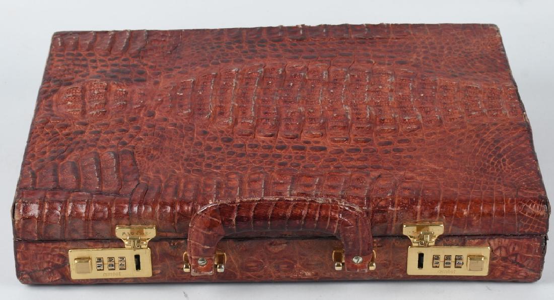 ALFREDO VERSACE ALLIGATOR BRIEFCASE: Original Alfredo Versace Alligator Skin Briefcase. Wonderful natural brownish red color. Exterior show almost no wear. Interior has very light wear. A very expensive case new. Comes with code for lock