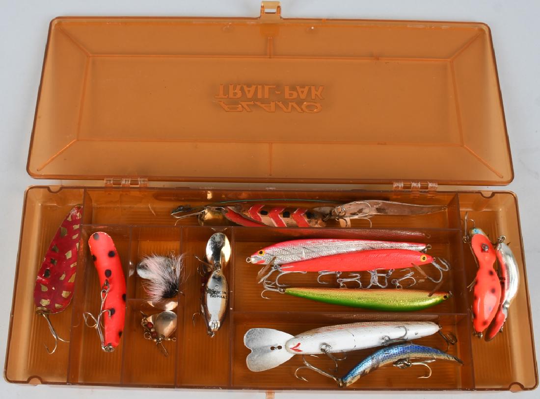 OVER 15 VINTAGE FISHING LURES MEPPS, HEDDON: 15+ vintage fishing lures in a Plano Trail-Pak case. Mostly wood and metal construction, jointed, one in the original box, ranging in size from approximately 2" to 7." Excellent.