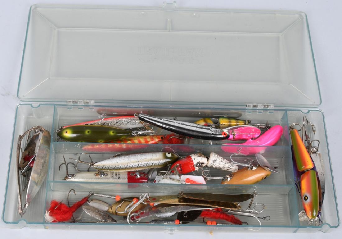 OVER 20 VINTAGE FISHING LURES MEPPS, HEDDON: 20+ vintage fishing lures in a Plano Trail-Pak case. Mostly wood and metal construction, jointed, one in the original box, ranging in size from approximately 2" to 7." Excellent.
