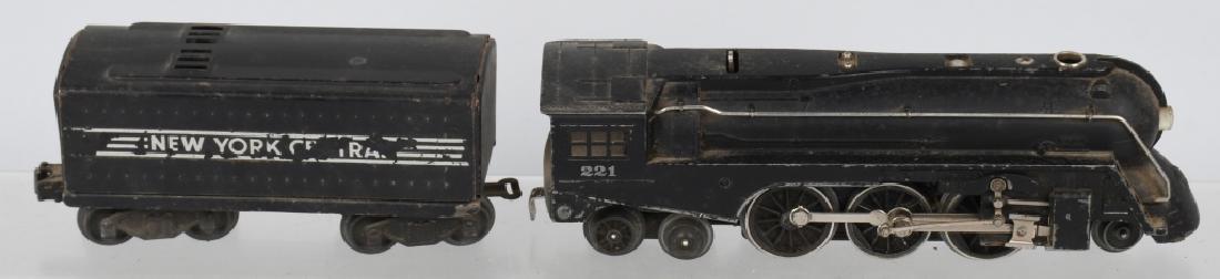 LIONEL POSTEWAR 221 ENGINE & 221W TENDER O-GAUGE: Lionel poswar 221 engine & 221w tender o-gauge. Engine has some light wear may clean to very good. Tender is in good condition has some decal loss. no box untested