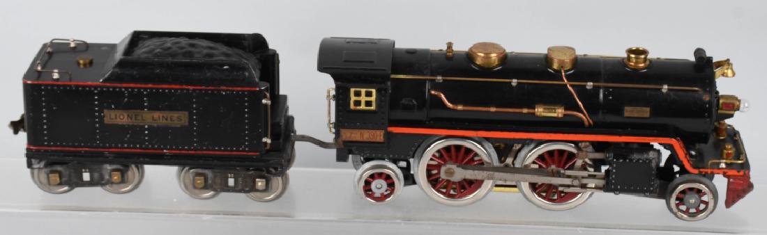 LIONEL STANDARD GAUGE 390E ENGINE & 390T TENDER: Lionel standard gauge 390e engine wheels have been replaced is original paint frame is strait no cracks excellent condition. 390t tender stripes have been repainted red otherwise in very good conditio