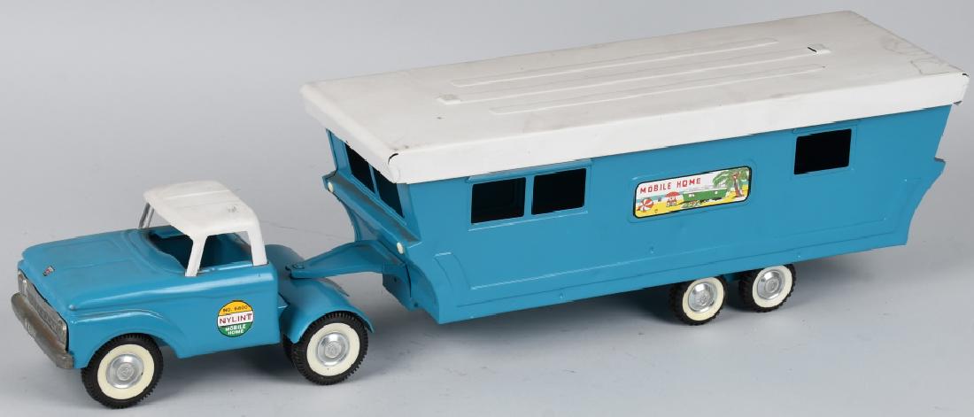 NYLINT Pressed Steel FORD No. 6600 MOBILE HOME: nice looking pressed steel toy that has been restored. Measures about 30" long and displays well. Excellent