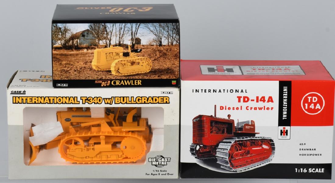 3 - TRACK TRACTORS die cast METAL w/ BOXES: Lot includes Ertl International T-340 with blade, Spec Cast International TD-14A, along with a Ertl Oliver OC-3 Crawler. All are 1:16 scale and have original boxes. Near Mint