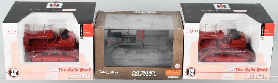 3-TRACTORS die cast CATERPILLAR & INTERNATIONAL: Lot includes 2 Spec Cast International Harvester TD-24 Crawlers, along with a Norscot Caterpillar model 20 Track Type tractor. The Internationals are 1:25 scale, and the Caterpillar is 1:16 scale. All