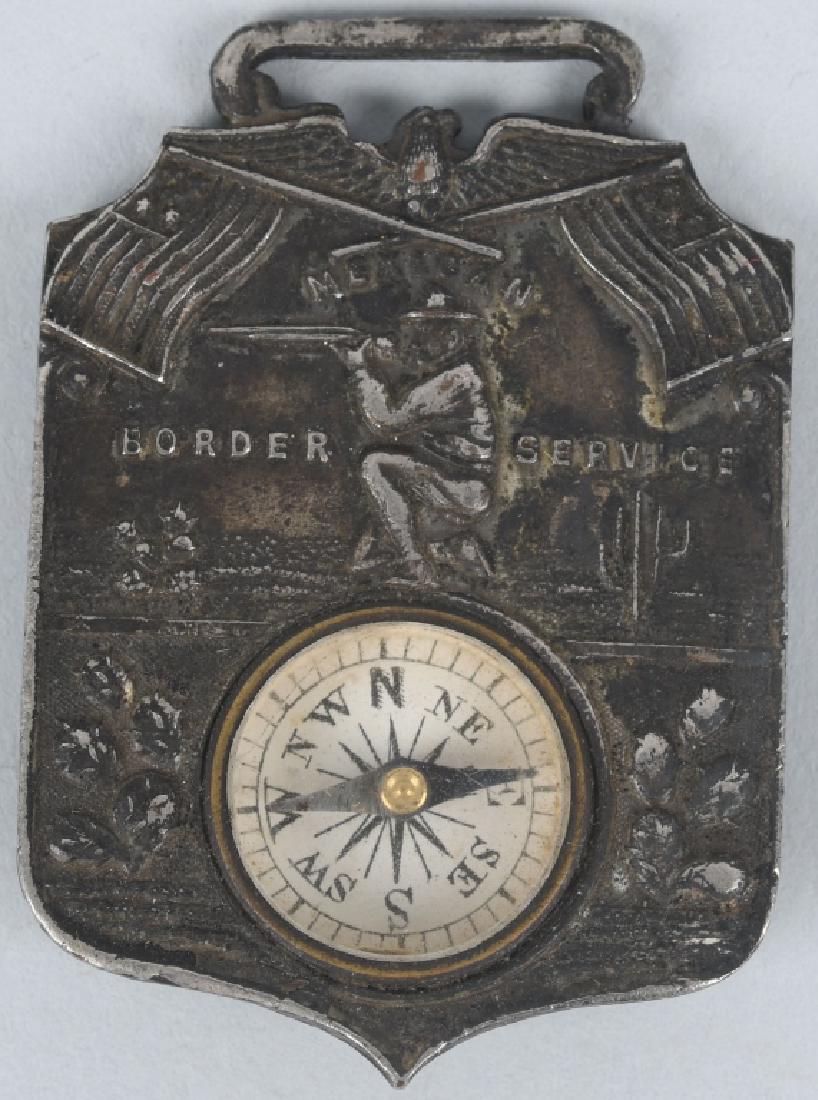 MEXICAN BORDER SERVICE WATCH FOB COMPASS: 1.4" x 1" silver watch fob hallmarked H. J. Marston, Brooklyn N.Y. Has small compass in the bottom, and reads "MEXICAN BORDER SERVICE" beneath a patriotic American eagle and flag motif. This was evide