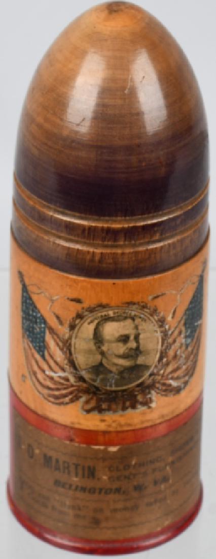 ADMIRAL GEORGE DEWEY BULLET COIN BACK: Unusual Admiral George Dewey wooden Bullet Coin Bank. Great image of Dewey with Flags. Banks has advertising for ID Martin Stores. 6 3/4" Excellent