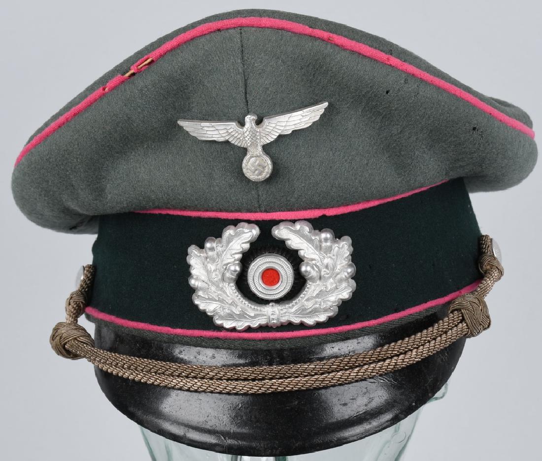 WWII NAZI GERMAN PANZER OFFICER VISOR CAP: Nice quality private purchase field-gray wool and rayon blend construction visor cap with a blue/green badge cloth centerband and pink wool waffenfarbe piping to the crown edge and both the top and bo