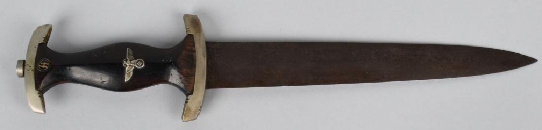WWII NAZI GERMAN SS DAGGER RZM 120/34: SS dagger features a roughly 22cm long double edged drop forged steel construction nickel/silver plated blade with a low central ridge. The obverse of the blade has a deep well defined acid etched mot