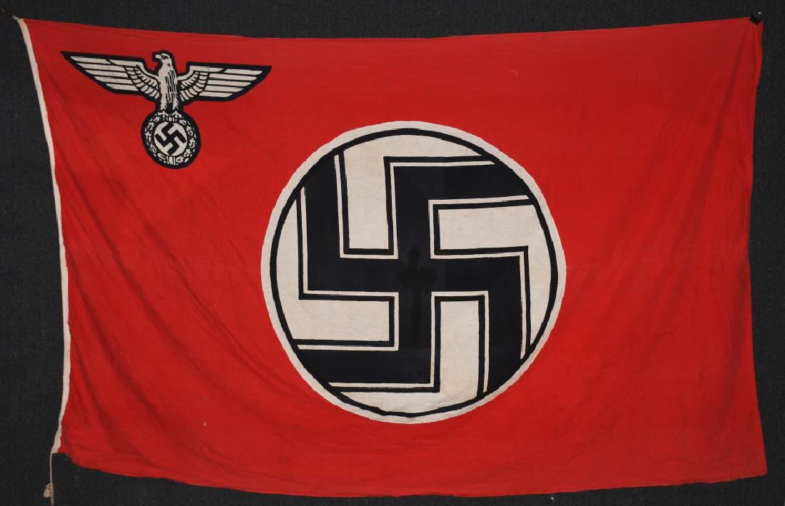 WWII NAZI GERMAN ARMY STATE SERVICE FLAG: A 1935 pattern double sided printed cotton/linen construction flag. The flag features a red base field white with a white central, circular field with a black and white bordered black static swastika 