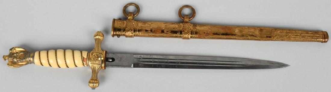 WWII NAZI GERMAN KRIEGSMARINE OFFICERS DAGGER: German World War II Naval Kriegsmarine Officers Dagger & Scabbard. Measures 16 5/8” long overall. The engraved blade is maker marked ‘Original Eikhorn Solingen’. Has their squirrel logo above. M