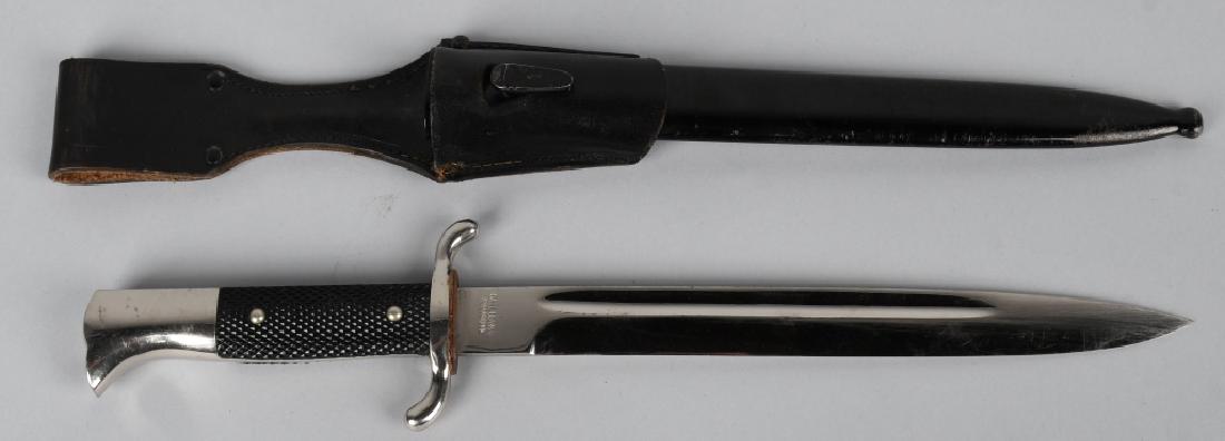 WWII NAZI GERMAN FIRE POLICE DRESS BAYONET W FROG: German World War II Fire Police Dress Bayonet & Scabbard with Belt Frog. Measures 15 5/8” long overall. The steel blade is maker marked ‘Carl Henkel Bielefield’. It measures 15/16” wide by 9 3