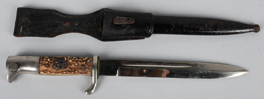 WWII NAZI GERMAN STAG HANDLED BAYONET W POLICE INS: German World War II Police Dress Bayonet & Scabbard with Belt Frog. Measures 13 7/8” long overall. Has an unmarked steel blade that measures 7/8” wide by 8 1/16” long. The black painted scabbard
