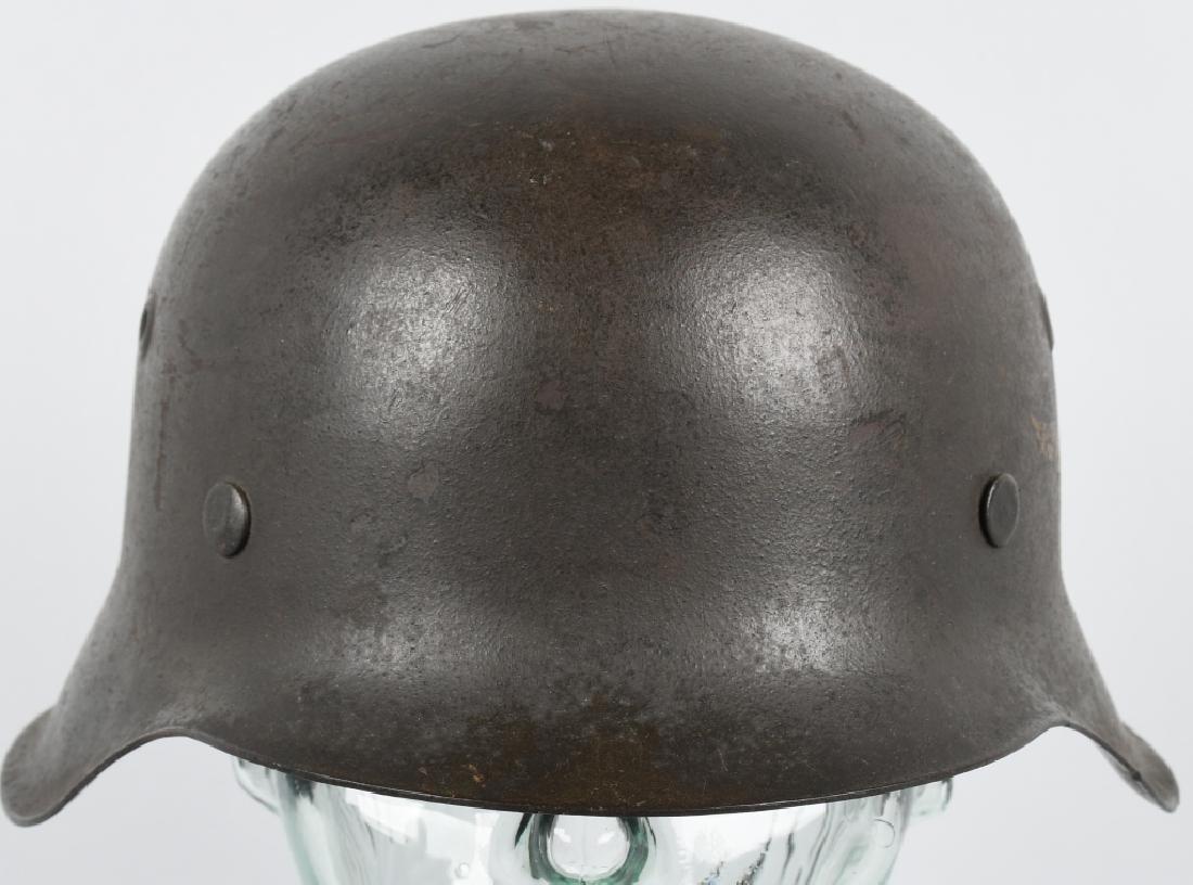 WWII NAZI GERMAN LUFTWAFFE M42 COMBAT HELMET: Helmet retains about 80% of its field-gray paint. Second pattern Luftwaffe eagle decal is also retained about 85%. All three liner retaining rivets intact. M31 tan leather liner is complete and in exc