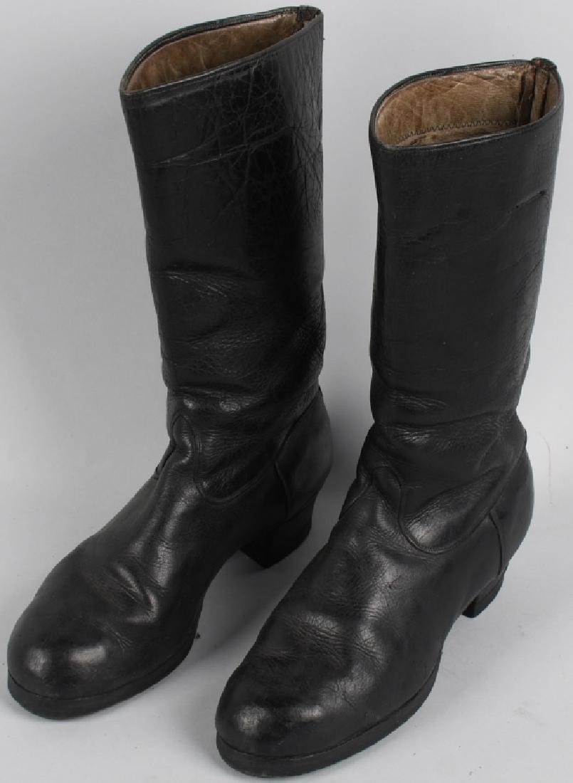 WWII NAZI GERMAN DJ/HJ MARCHING BOOTS: Nice quality tall blackened leather construction boots are roughly 31cm tall from the top of the heel to the top of the back calf section. The boots have a machine stitched central vertical seam to th