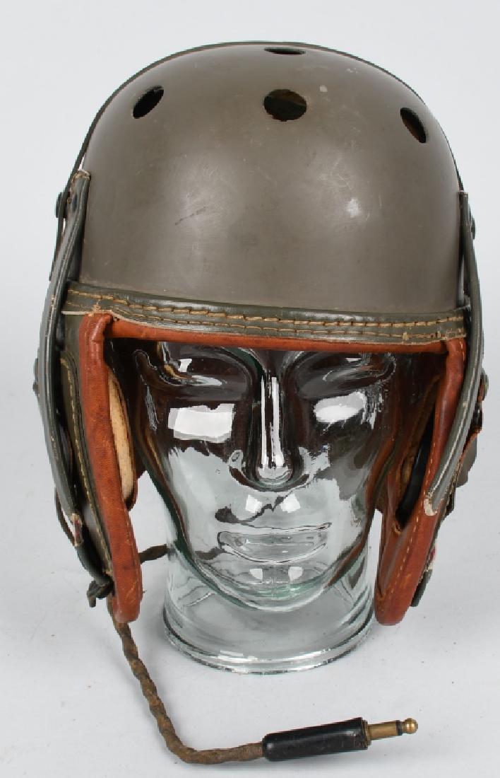 WWII US M38 TANK HELMET W/ R-14 RECEIVERS: This is a nearly mint WWII example of the classic M38 tanker helmet used by American tank crews in world war two. Helmet still retains the original R-14 receivers and are in EXCELLENT condition size 7